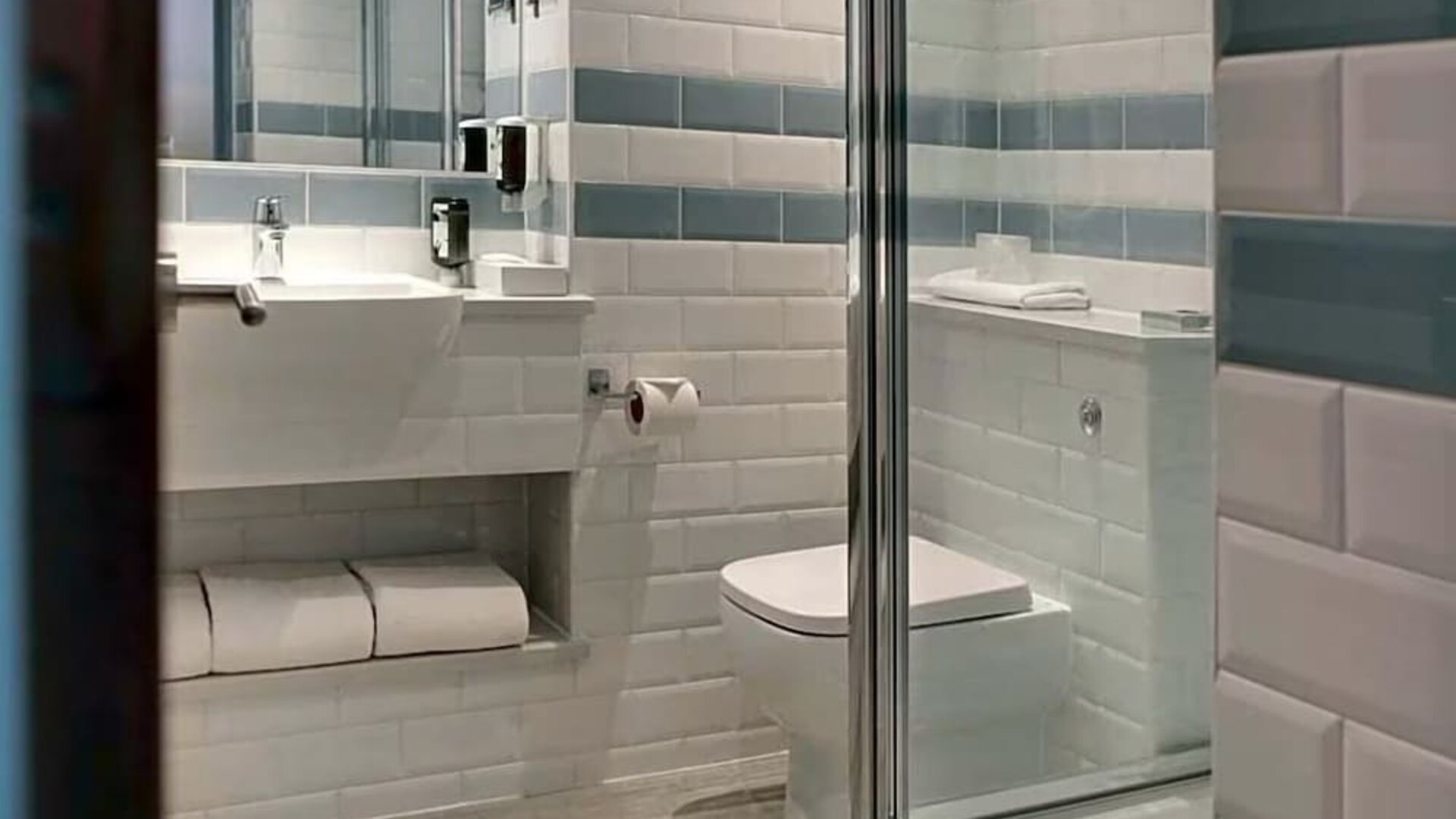Private guest bathroom with shower at Aparthotel Best Western Plus London Croydon.