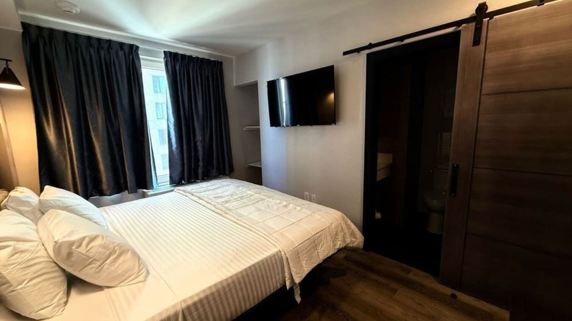 Romantic king bed at BKWAY HOTEL.