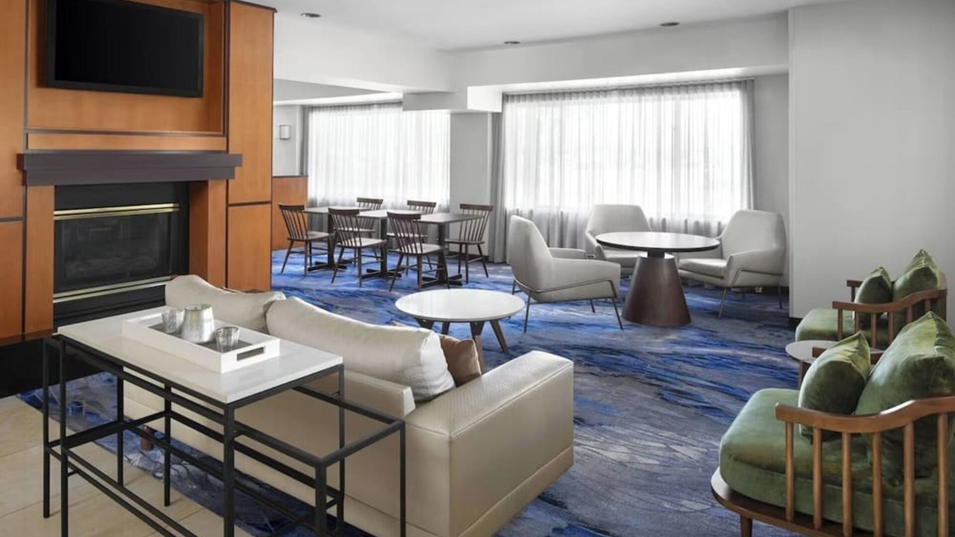 Lobby and coworking lounge at Fairfield Inn By Marriott Denver Airport.