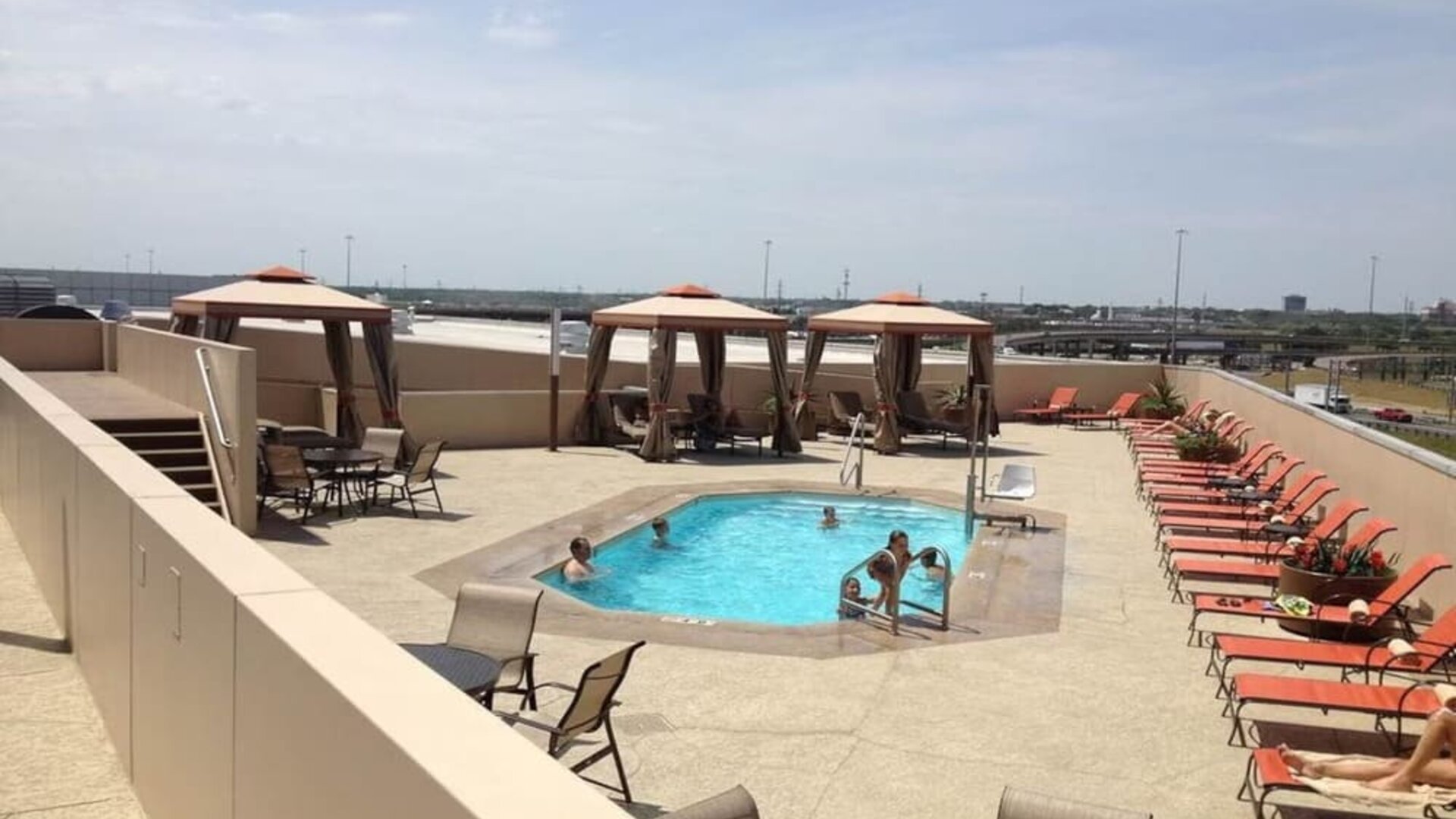 Refreshing outdoor pool in rooftop of Hyatt Regency Dallas.