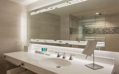 Guest bathroom with shower at Hyatt Regency Dallas.