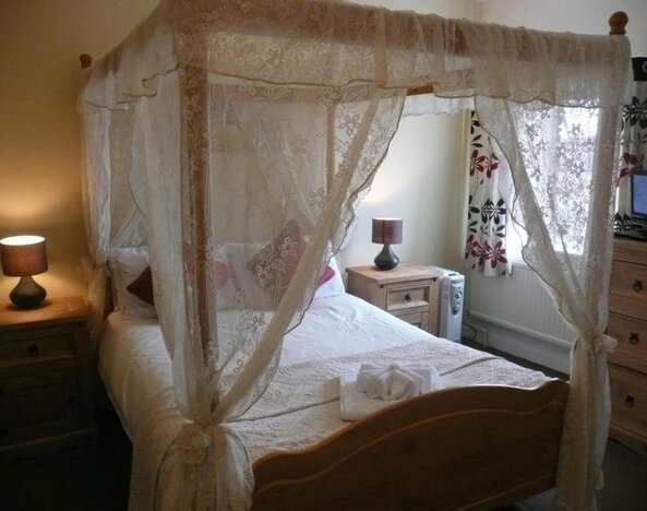 King bed at Rothwell House Hotel.