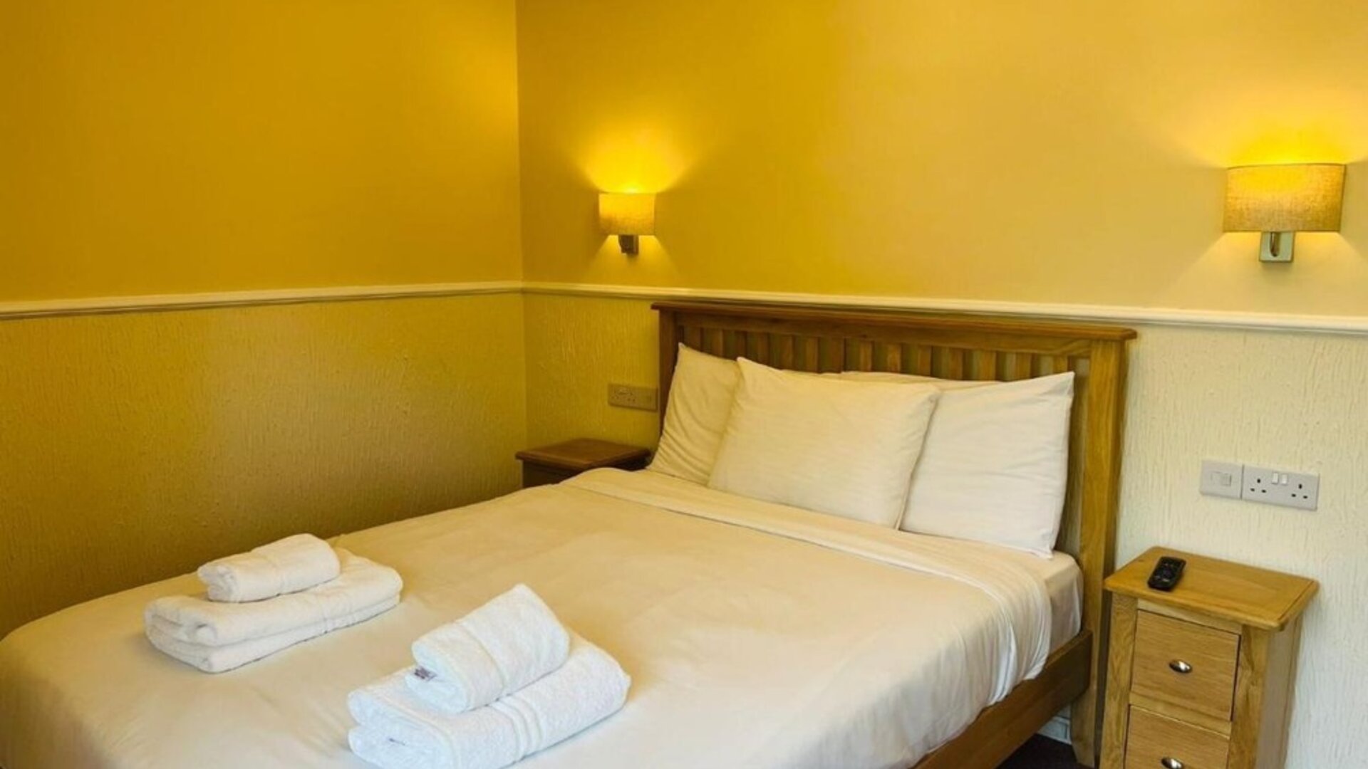 King bed at Rothwell House Hotel.
