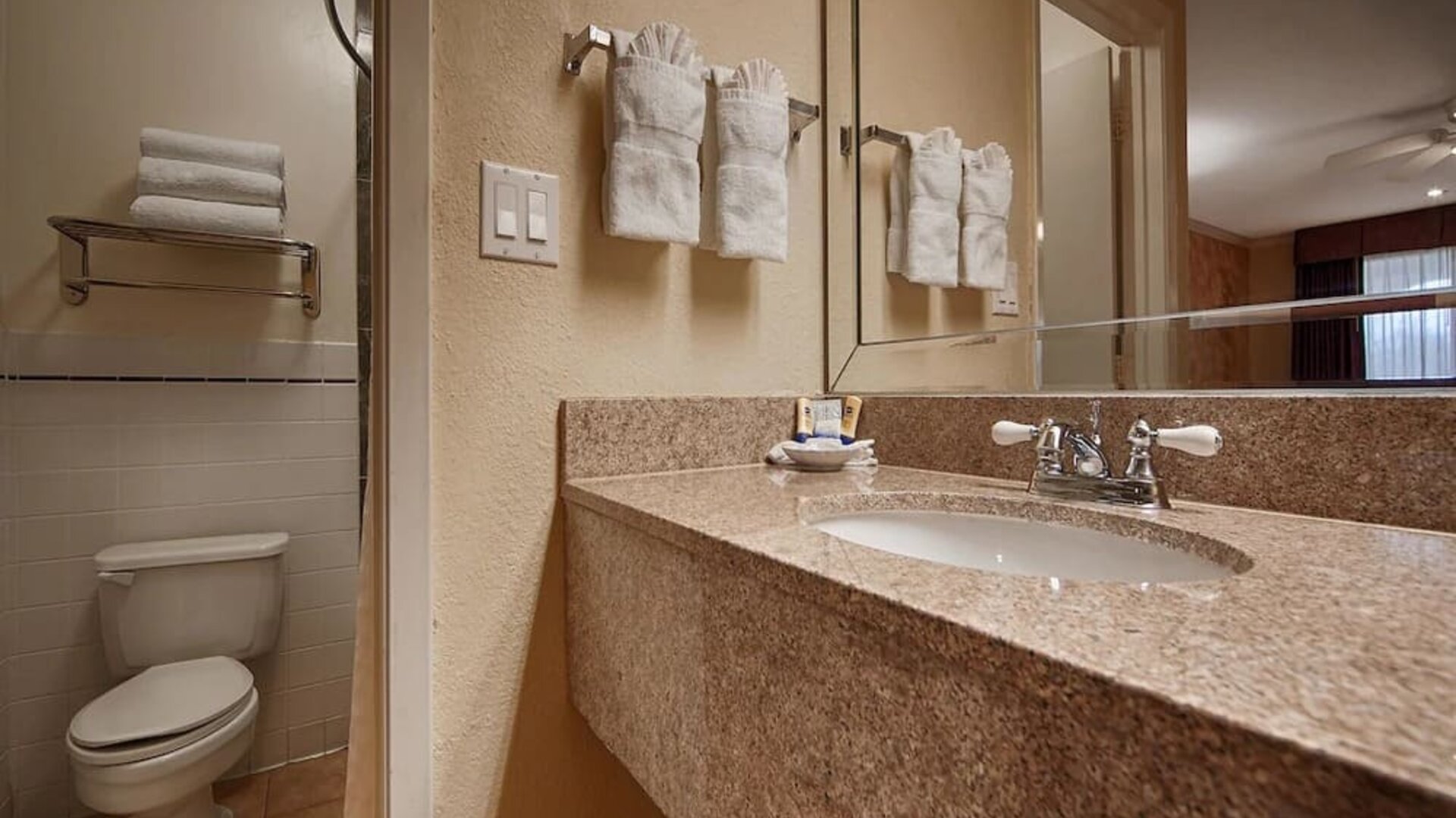 Guest bathroom with shower at Best Western Pearland Inn.
