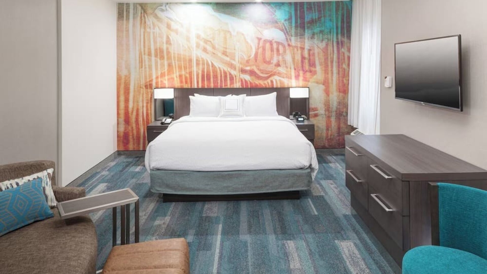 Day use room with sofa at Courtyard By Marriott Fort Worth Historic Stockyards.