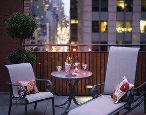 Rooftop lounge chairs at The Muse New York.