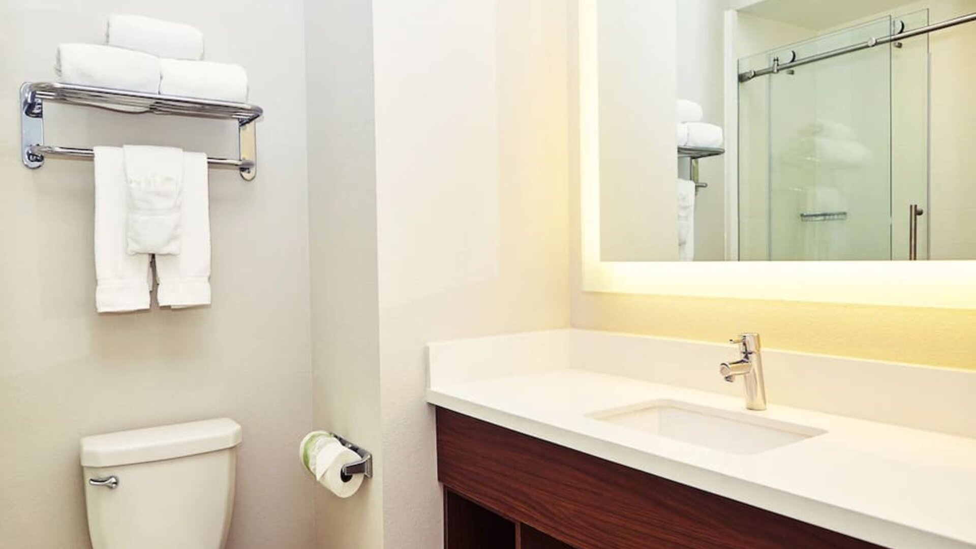 Guest bathroom with shower at Holiday Inn Express & Suites Corona.