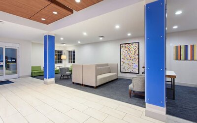 Lobby and coworking lounge at Holiday Inn Express & Suites Corona.