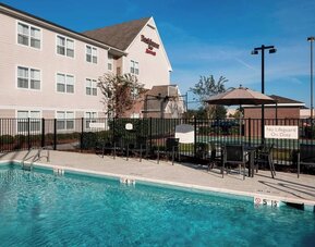 Refreshing outdoor pool at Residence Inn By Marriott Hattiesburg.