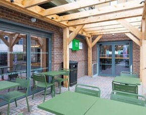 Terrace with seating at Ibis London Gatwick Airport Hotel.