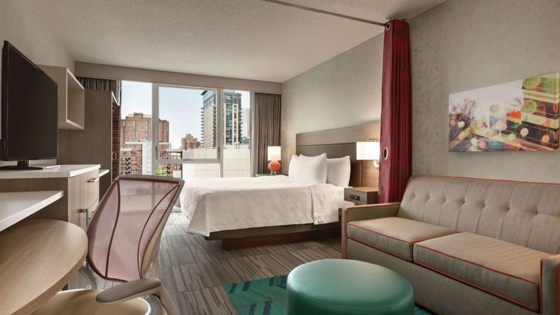 Day use room with work desk and sofa at Home2 Suites By Hilton Chicago River North.
