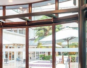 Outdoor terrace seating at DoubleTree By Hilton Paris Bougival.