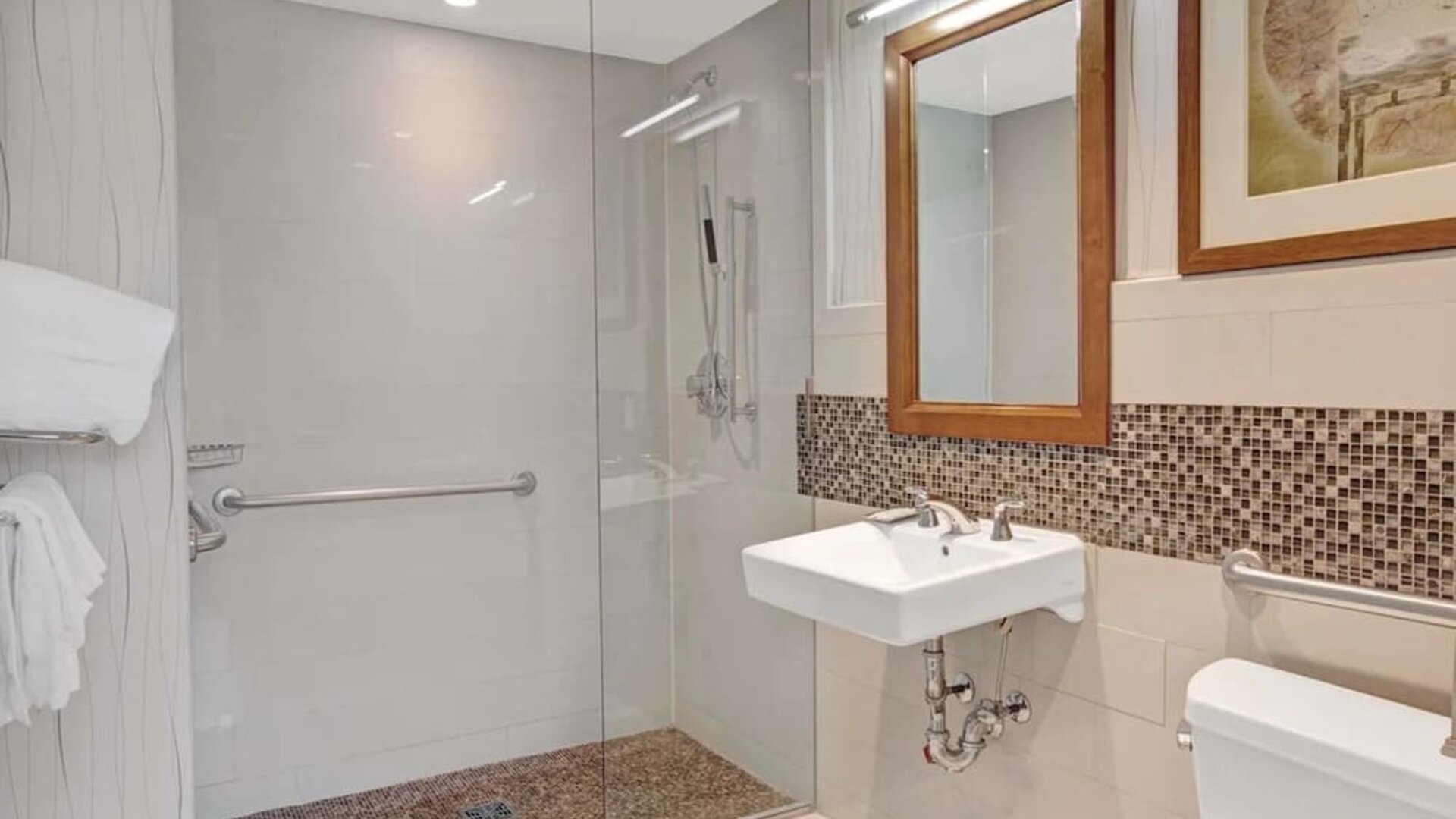 Guest bathroom with shower at Wyndham Garden Chinatown NYC.