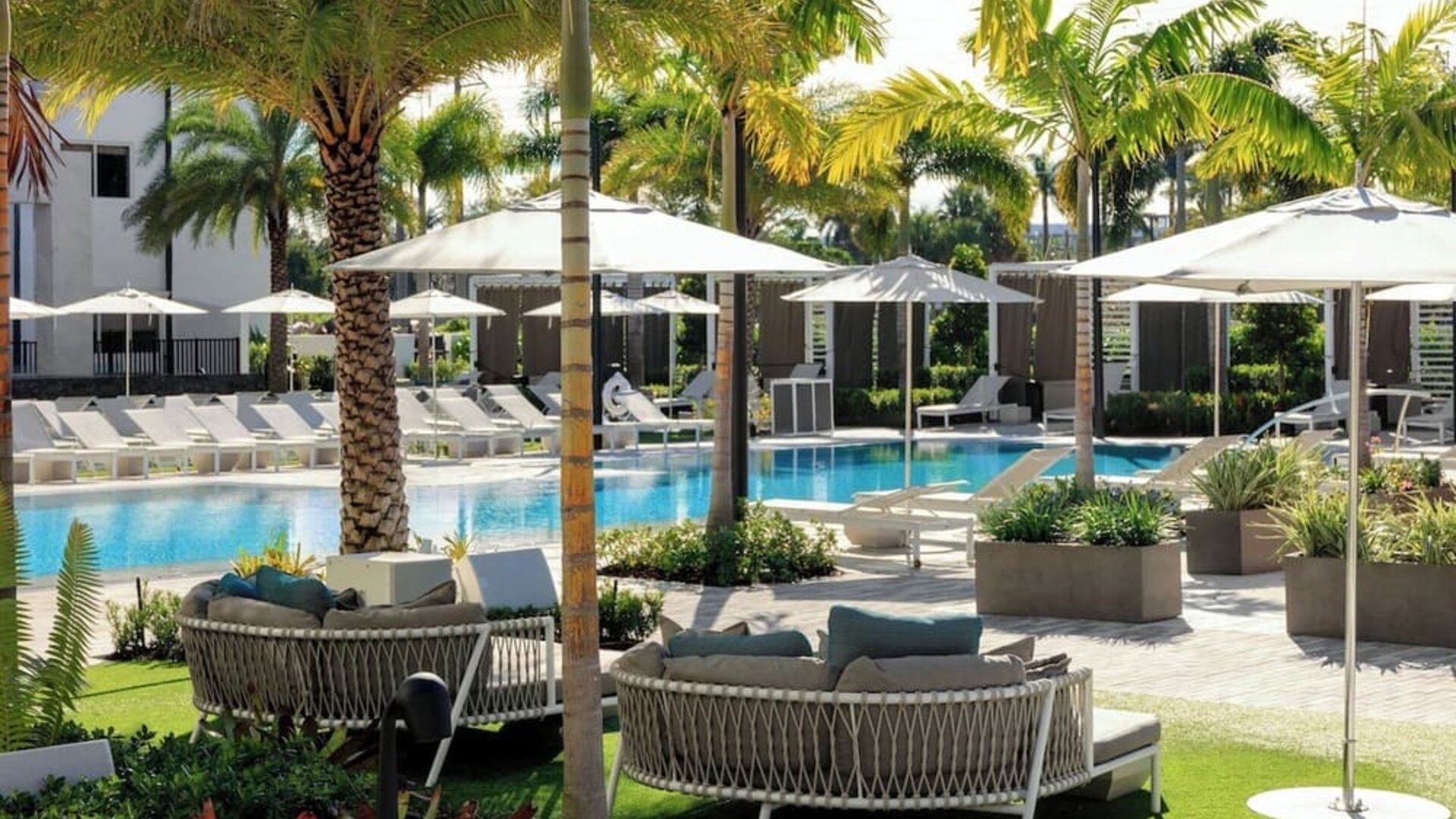 Lounge chairs beside the pool at Renaissance Boca Raton Hotel.
