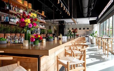 Bar and kitchen at The Envoy Hotel, Autograph Collection.