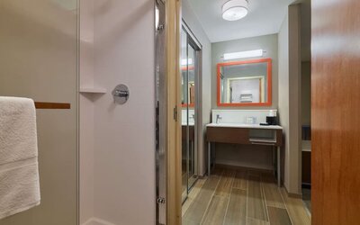 Guest bathroom with shower at Hampton Inn & Suites Providence/Smithfield.