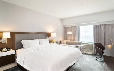 Day use room with work desk and sofa at Hampton Inn Philadelphia Center City - Convention Center.
