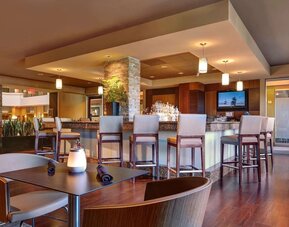 Hotel bar with lounge seating at Embassy Suites By Hilton San Diego-La Jolla.