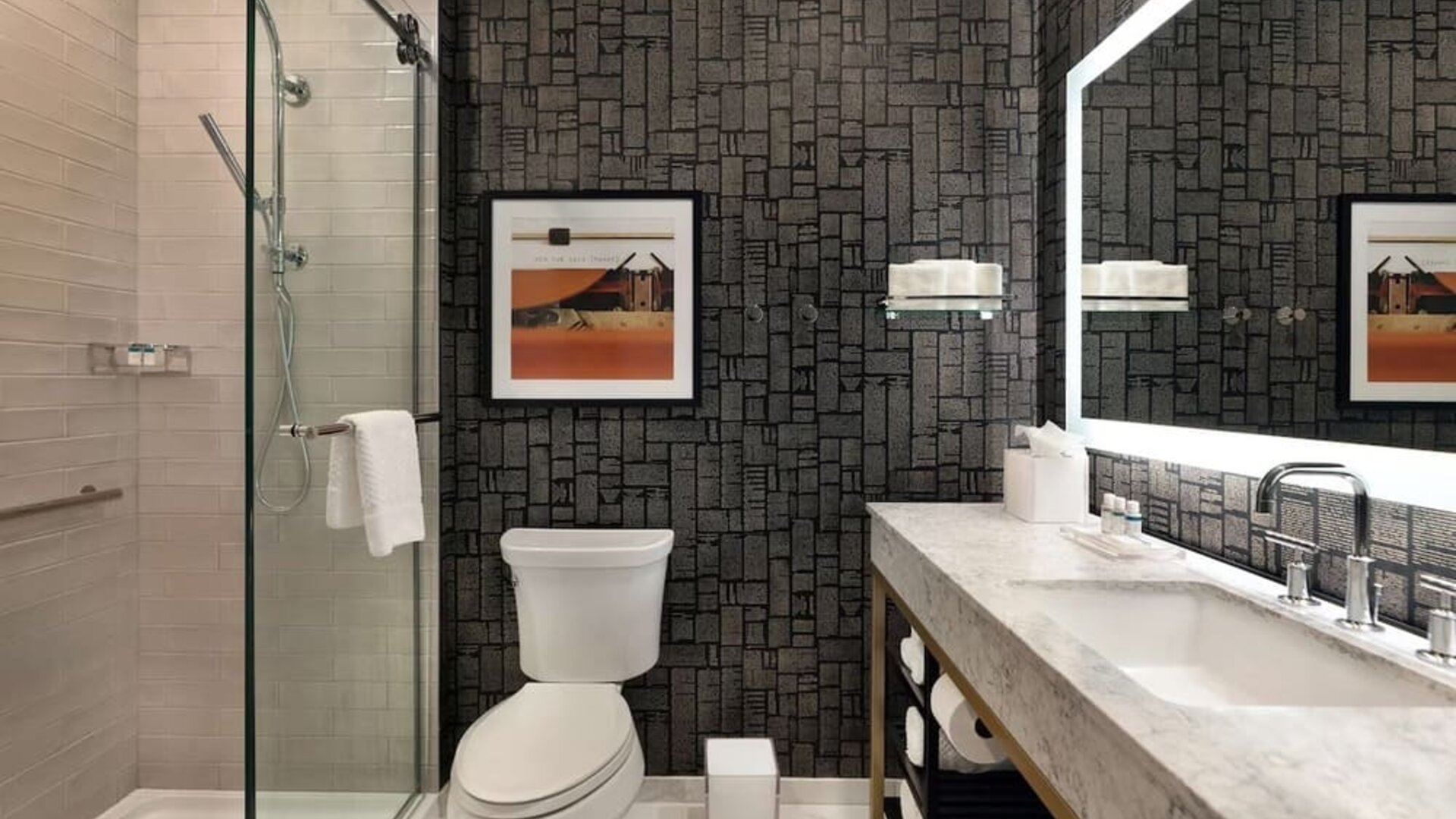 Guest bathroom with shower at The Slate Denver, Tapestry Collection By Hilton.