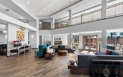 Lobby and coworking lounge at Hampton Inn & Suites Phoenix/Gilbert.