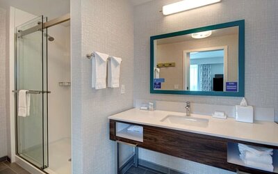 Guest bathroom with shower at Hampton Inn & Suites Sunnyvale Silicon Valley.
