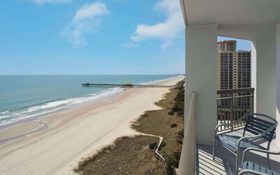 Balcony from day use room overlooking the ocean at Embassy Suites By Hilton Myrtle Beach Oceanfront Resort.