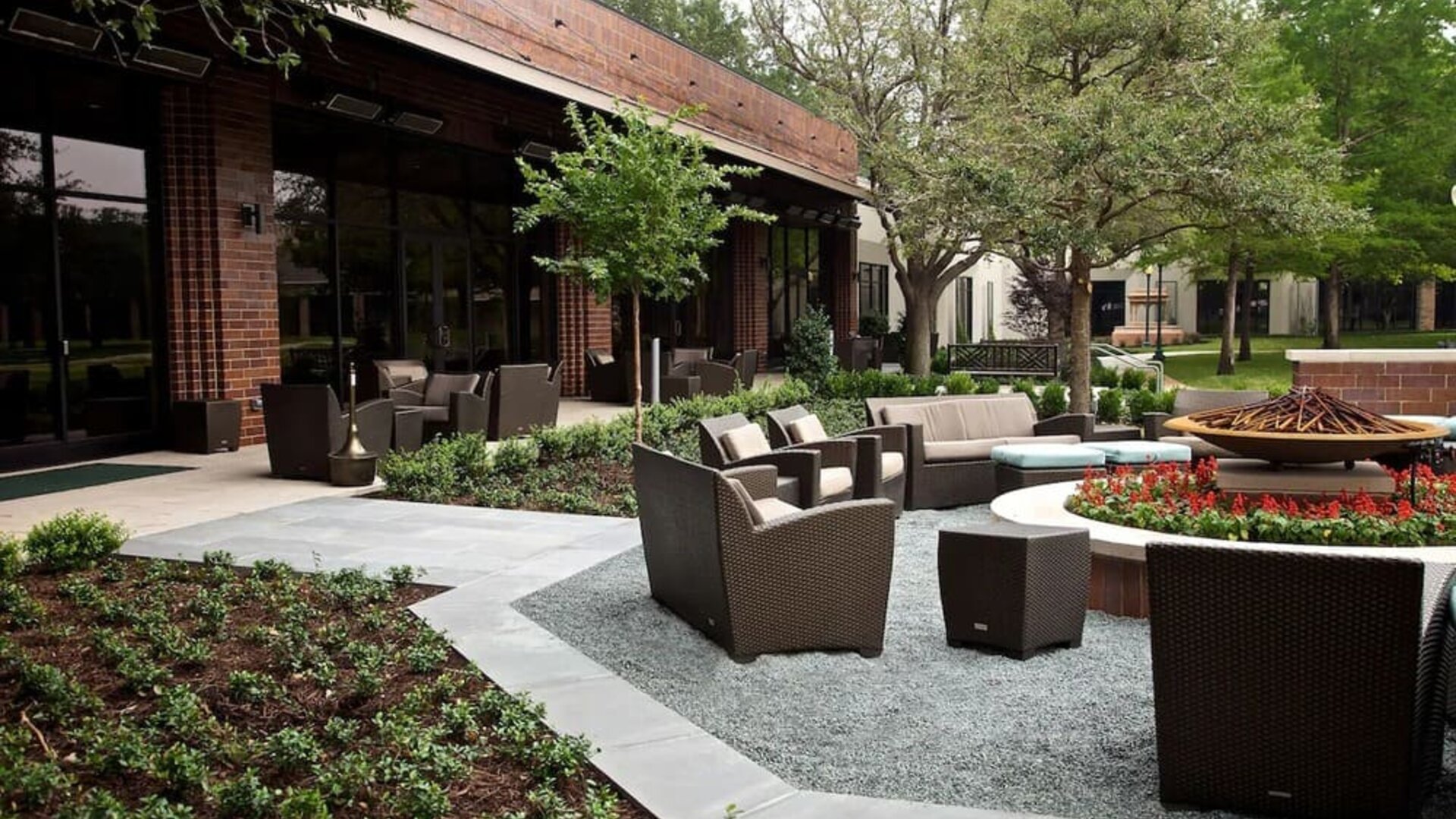 Firepit surrounded by outdoor furniture at Hilton Anatole.