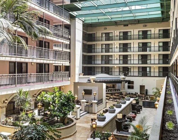 Lobby and coworking lounge at Embassy Suites By Hilton Los Angeles International Airport South.