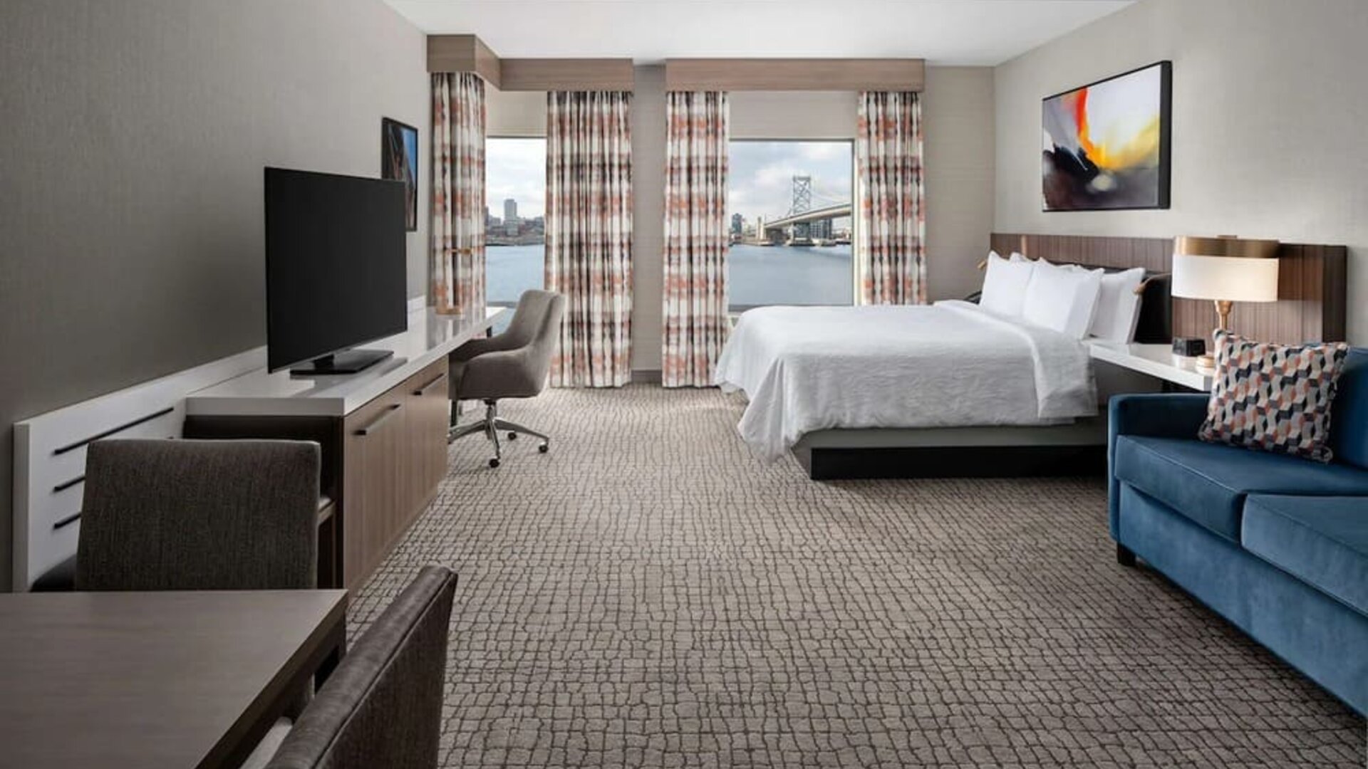 Spacious day use room with living area at Hilton Garden Inn Camden Waterfront Philadelphia.