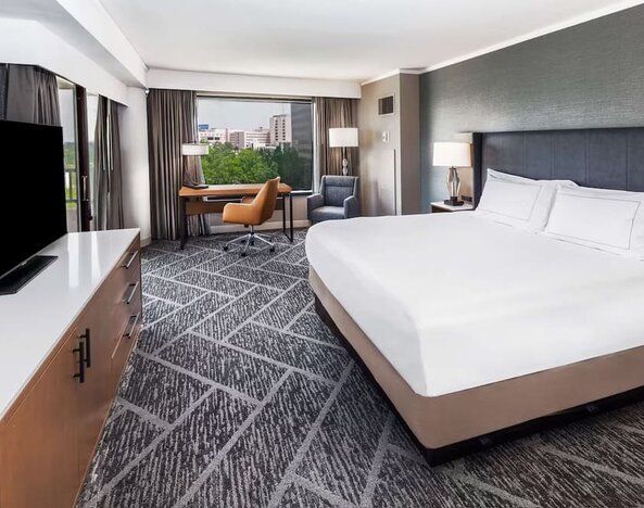 Day use room with work desk and natural light at DoubleTree By Hilton Tulsa - Warren Place.