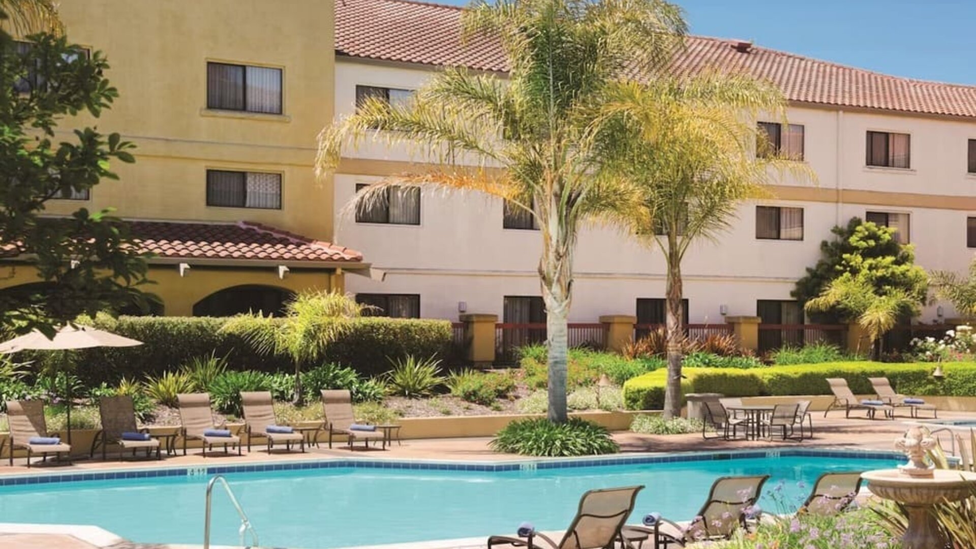 Refreshing outdoor pool surrounded by sun loungers at DoubleTree By Hilton Sonoma Wine Country.