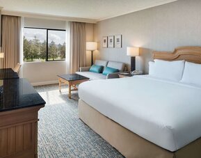 Day use room with work desk and sofa at DoubleTree By Hilton Sonoma Wine Country.