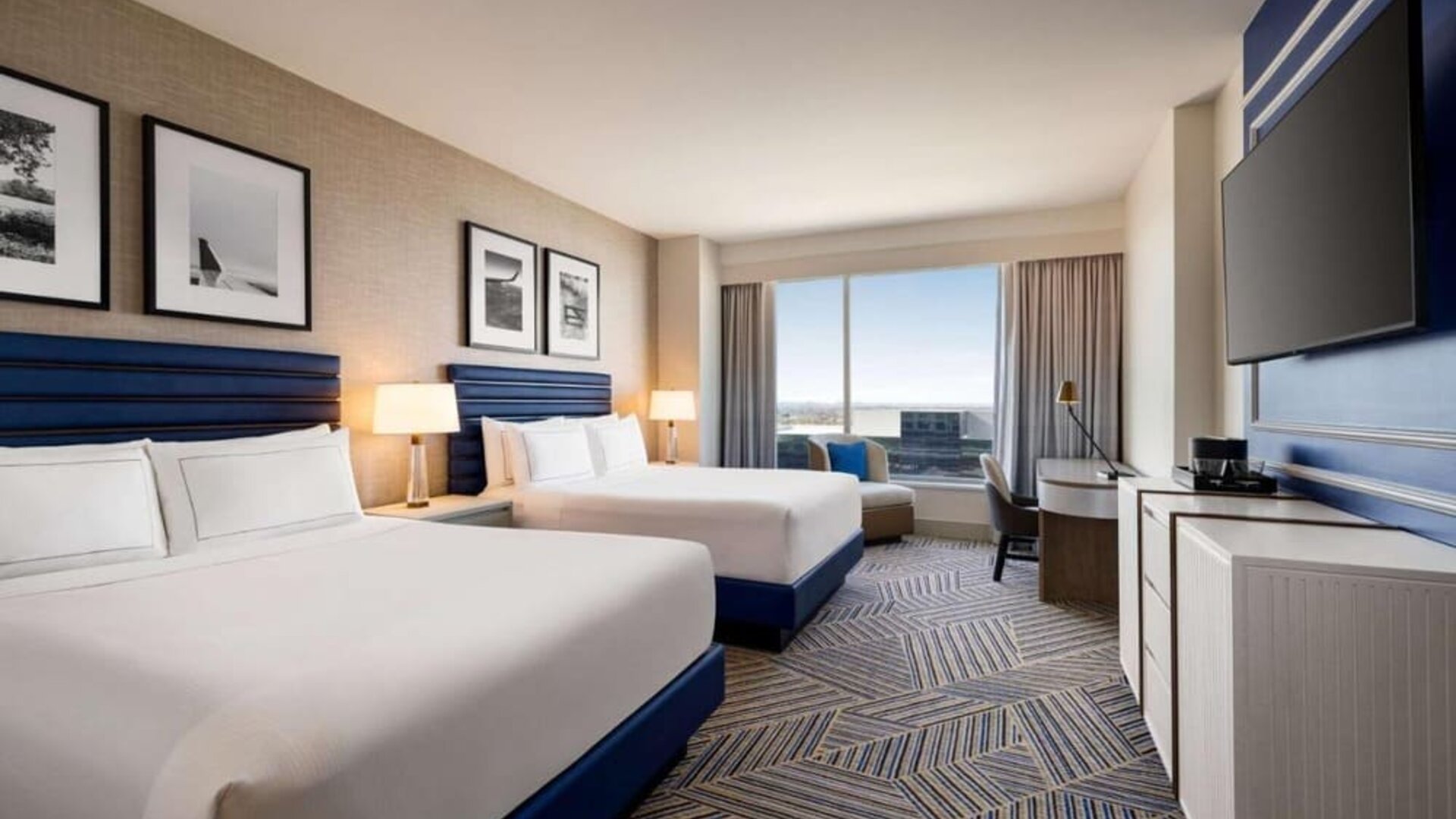 Day use room with two beds and workdesk at Hilton BNA Nashville Airport Terminal.
