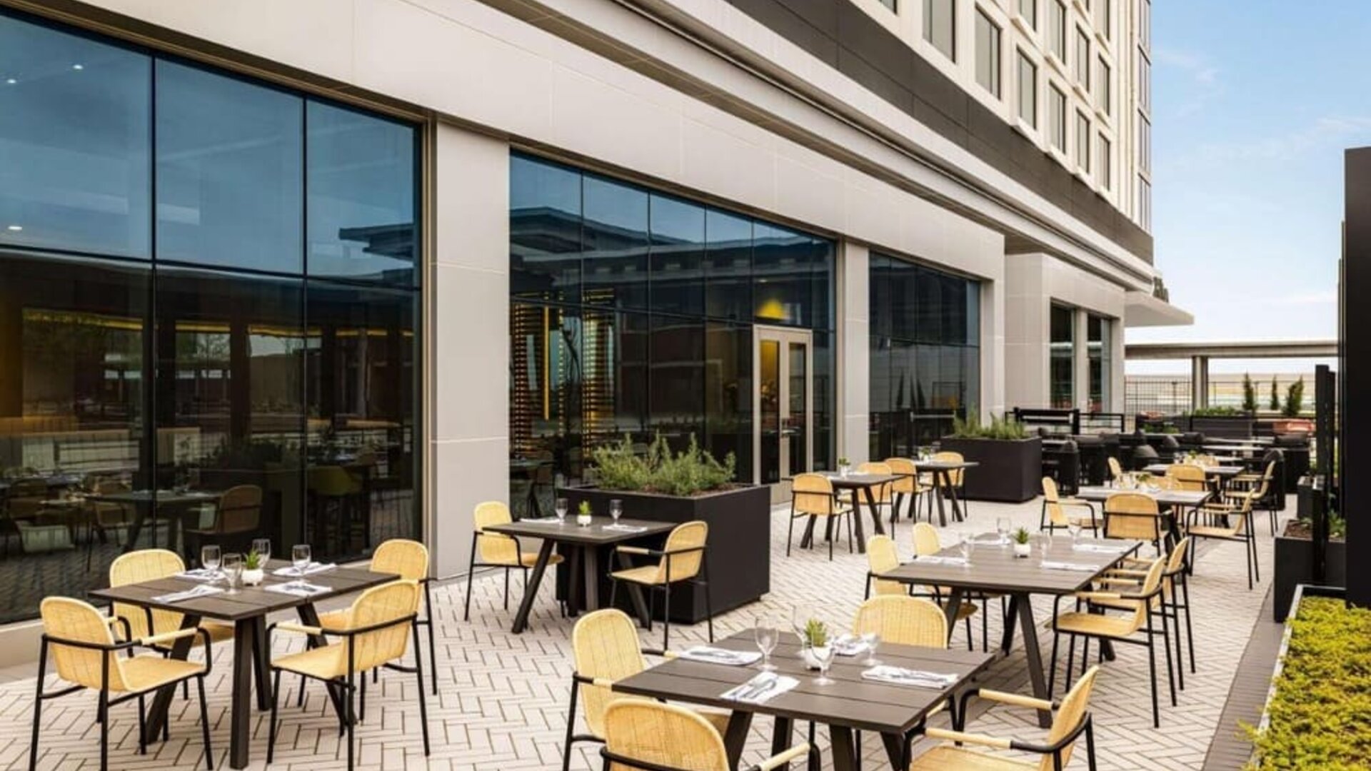 Hotel terrace with seating at Hilton BNA Nashville Airport Terminal.
