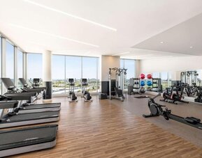 Fully equipped fitness center at Hilton BNA Nashville Airport Terminal.
