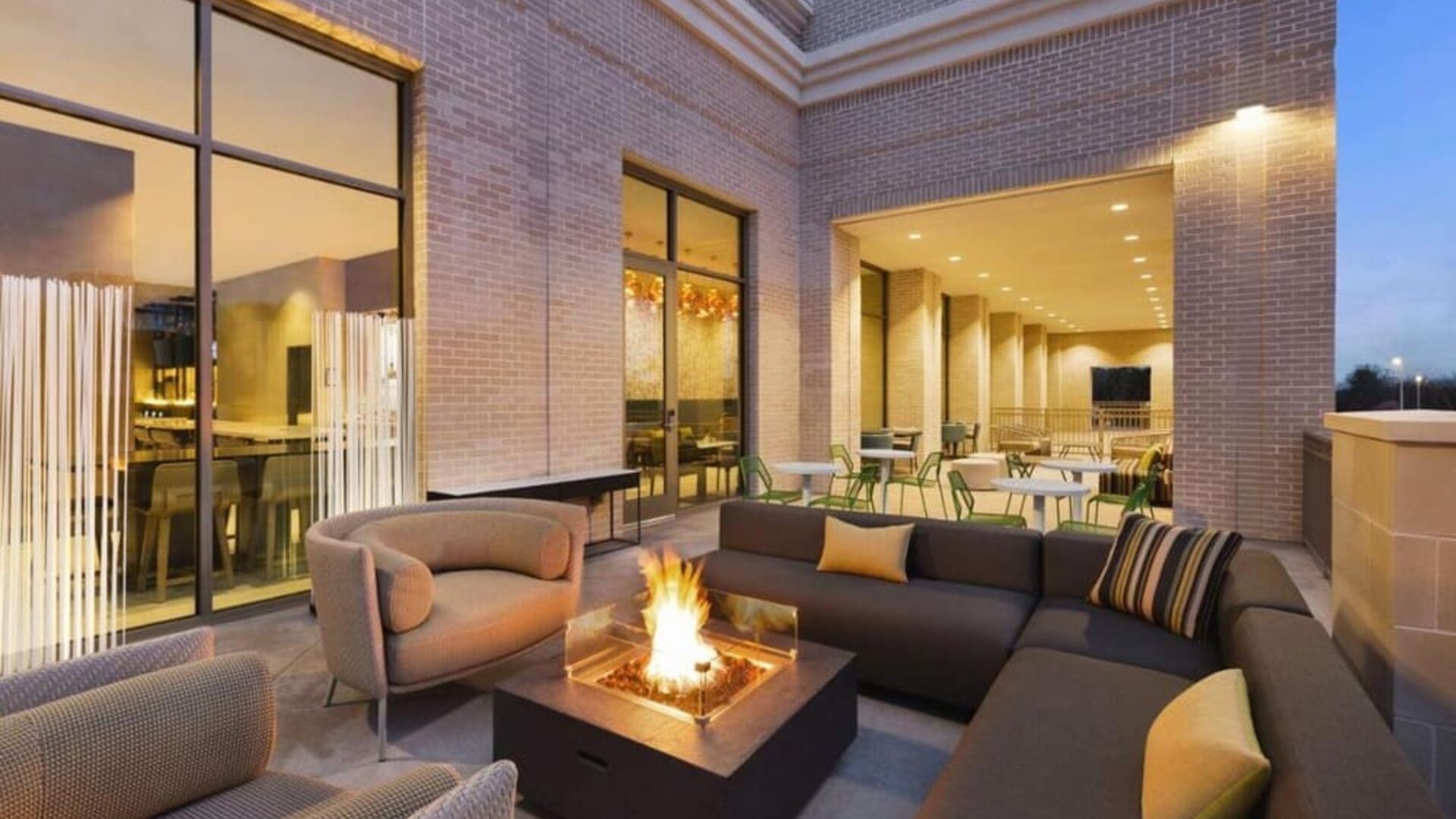 Hotel terrace with lounge area and fireplace at Hilton Garden Inn Nashville West End Avenue.