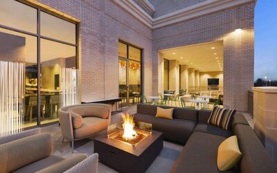 Hotel terrace with lounge area and fireplace at Hilton Garden Inn Nashville West End Avenue.