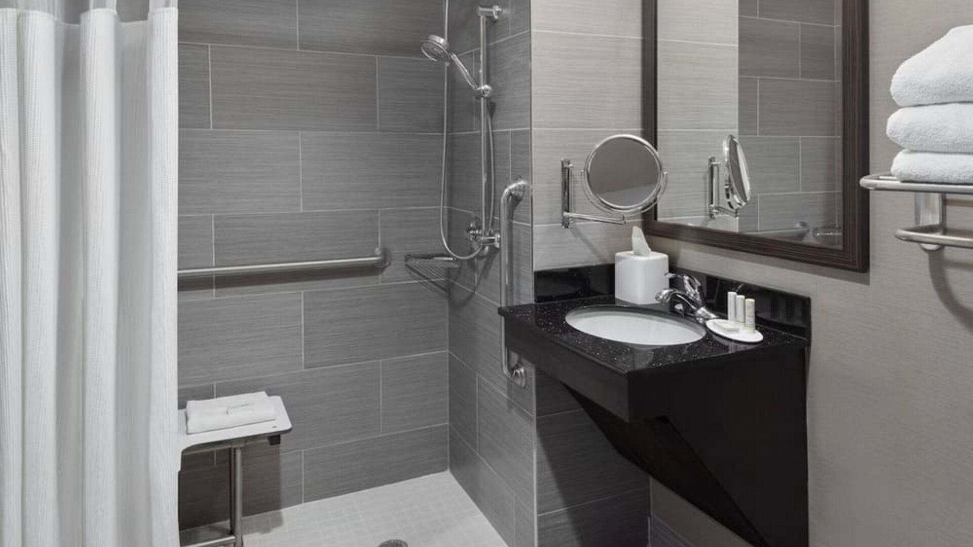 Ptivate guest bathroom with shower at Fairfield Inn & Suites By Marriott New York Staten Island.