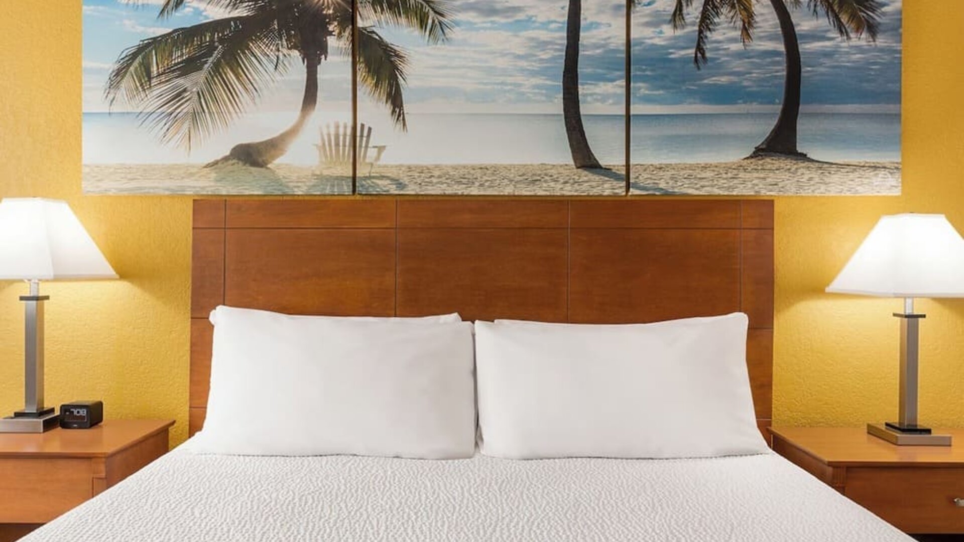 King bed at EnVision Hotel Miami International Airport.
