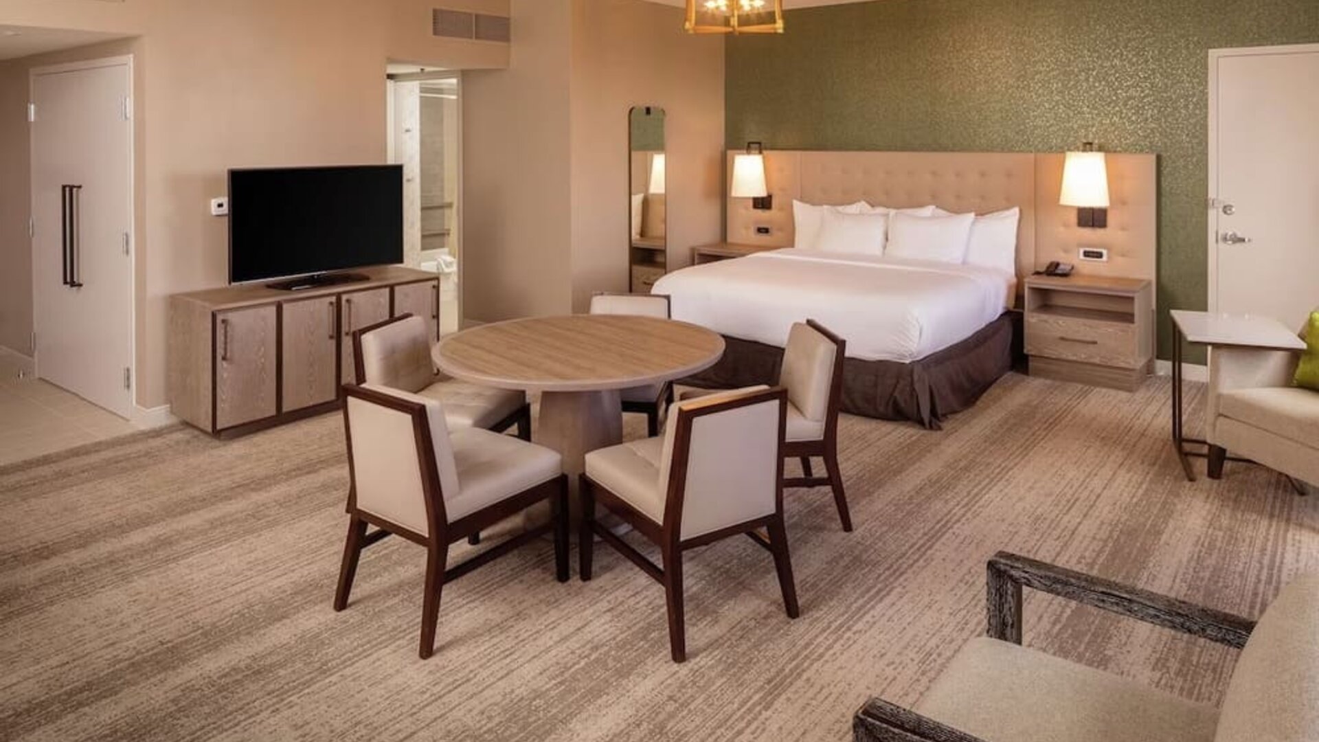 King suite with dining table at Hilton Birmingham At UAB.