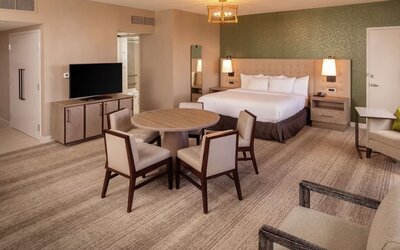 King suite with dining table at Hilton Birmingham At UAB.