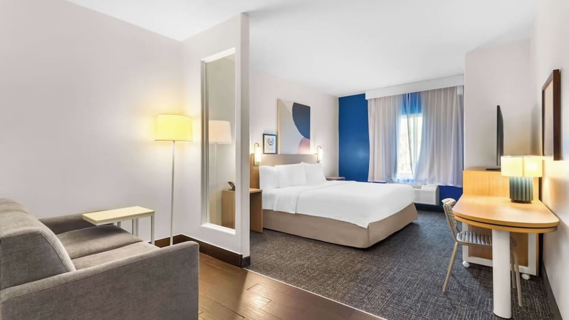 Bright and spacious day use room with lounge area at Spark By Hilton Pearland.