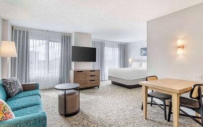 Day use room with workspace and lounge area at Sonesta ES Suites San Antonio Downtown Alamo Plaza.