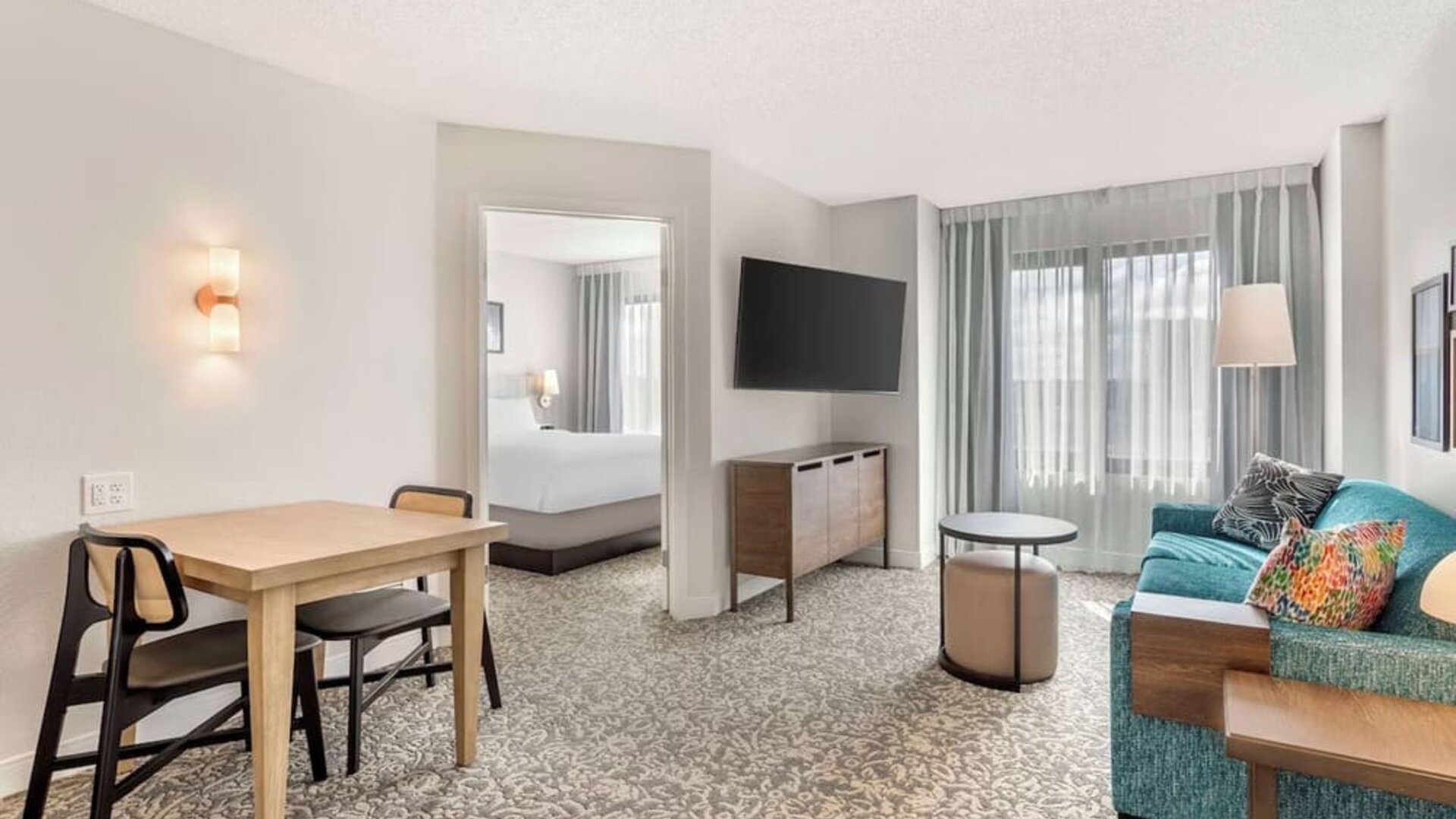 Day use suite with lounge area and workspace at Sonesta ES Suites San Antonio Downtown Alamo Plaza.