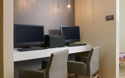 Business center with comfortable seating and printer at Sonesta ES Suites Fort Worth Fossil Creek.