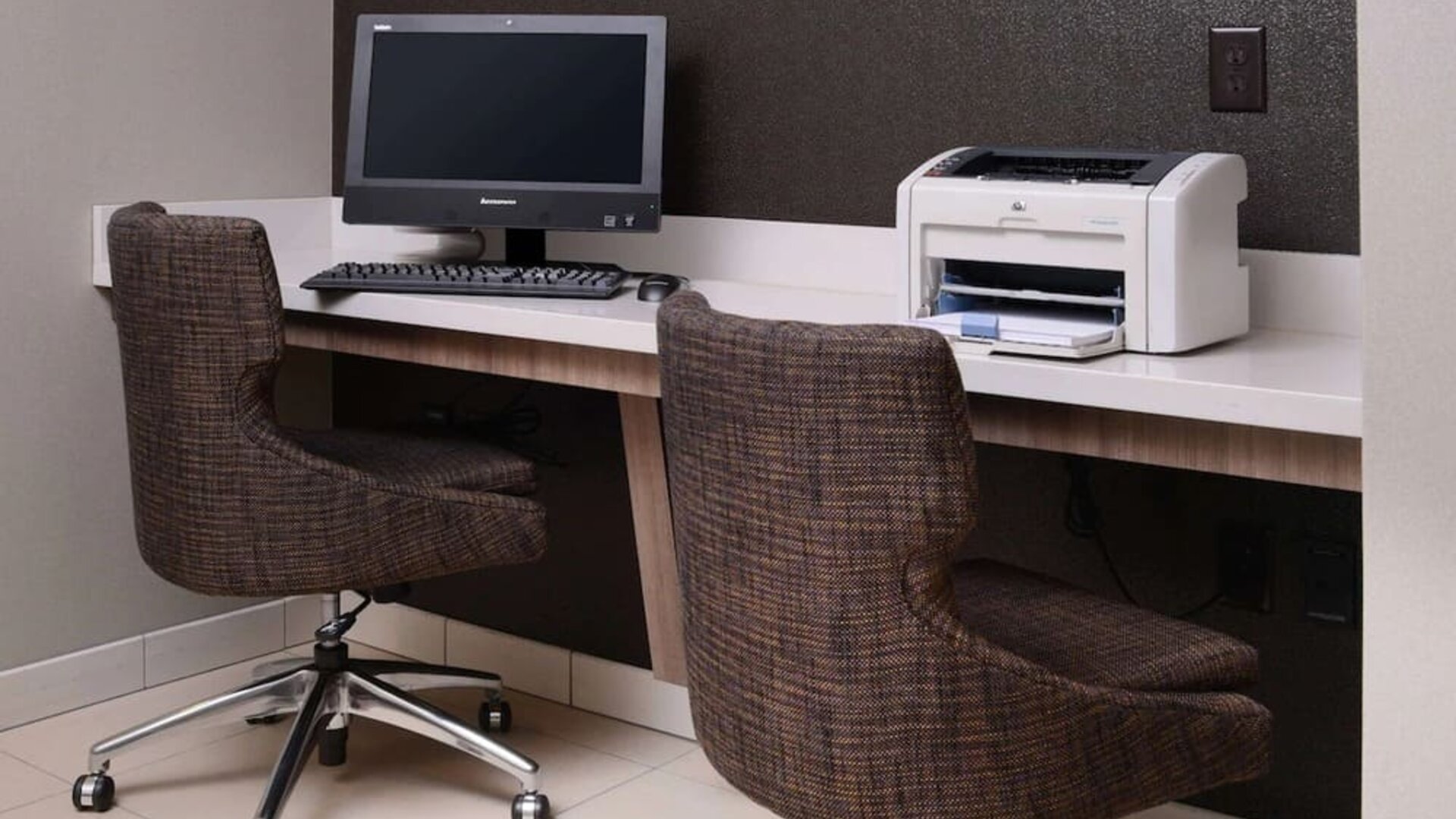 Business center with computer, printer and comfortable seating at Sonesta ES Suites Dallas Medical Market Center.