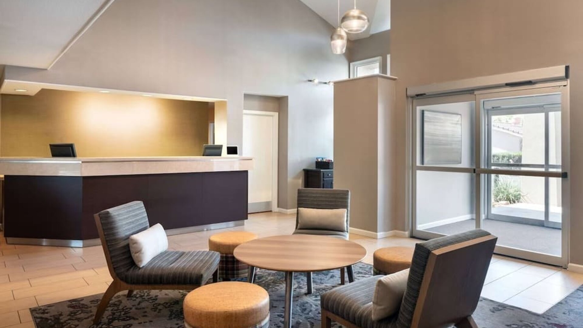 Hotel reception with lounge seating at Sonesta ES Suites Tempe.
