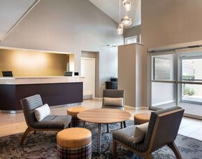 Hotel reception with lounge seating at Sonesta ES Suites Tempe.