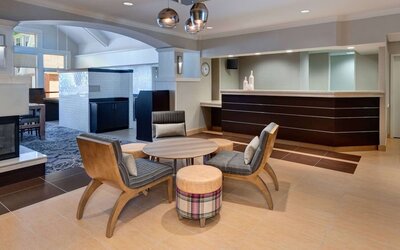 Reception and lounge area at Sonesta ES Suites Atlanta Alpharetta North Point Mall.