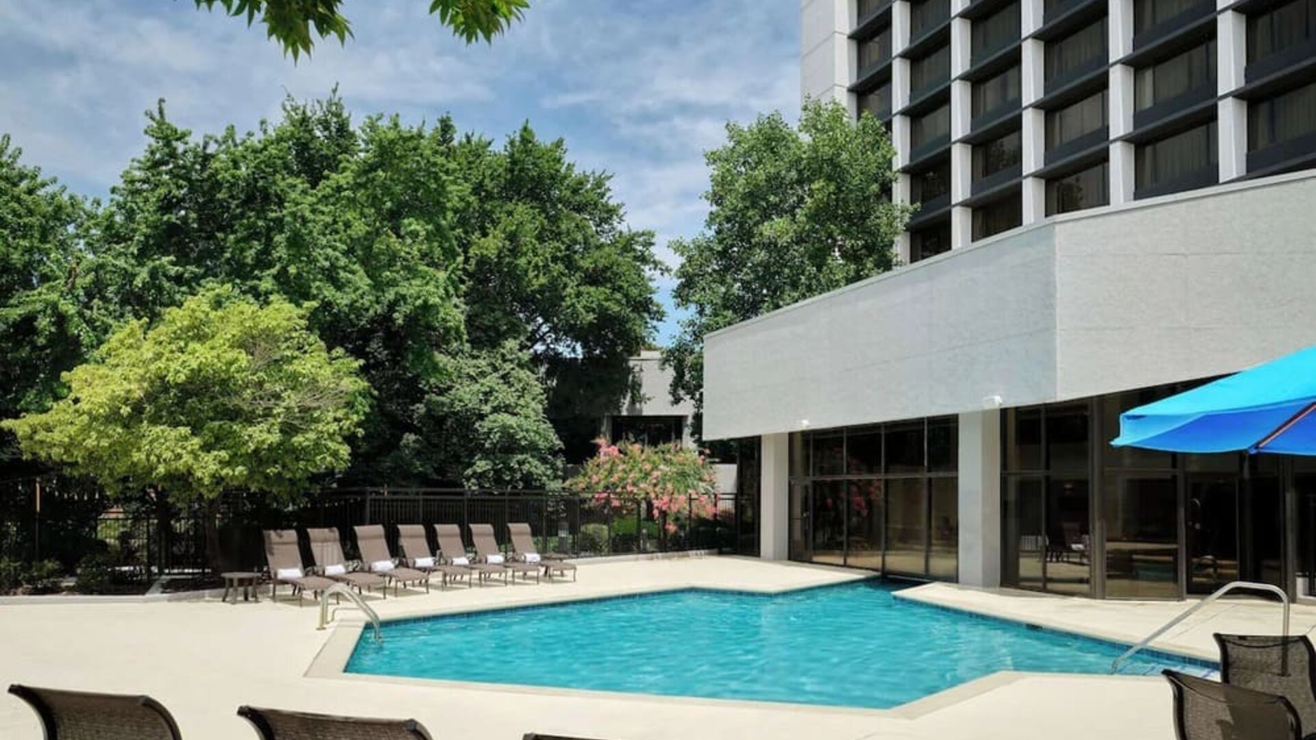 Outdoor pool with lounge chairs at Sonesta Nashville Airport.